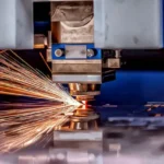 Photo of an industrial cutter, working on our laser cut flanges